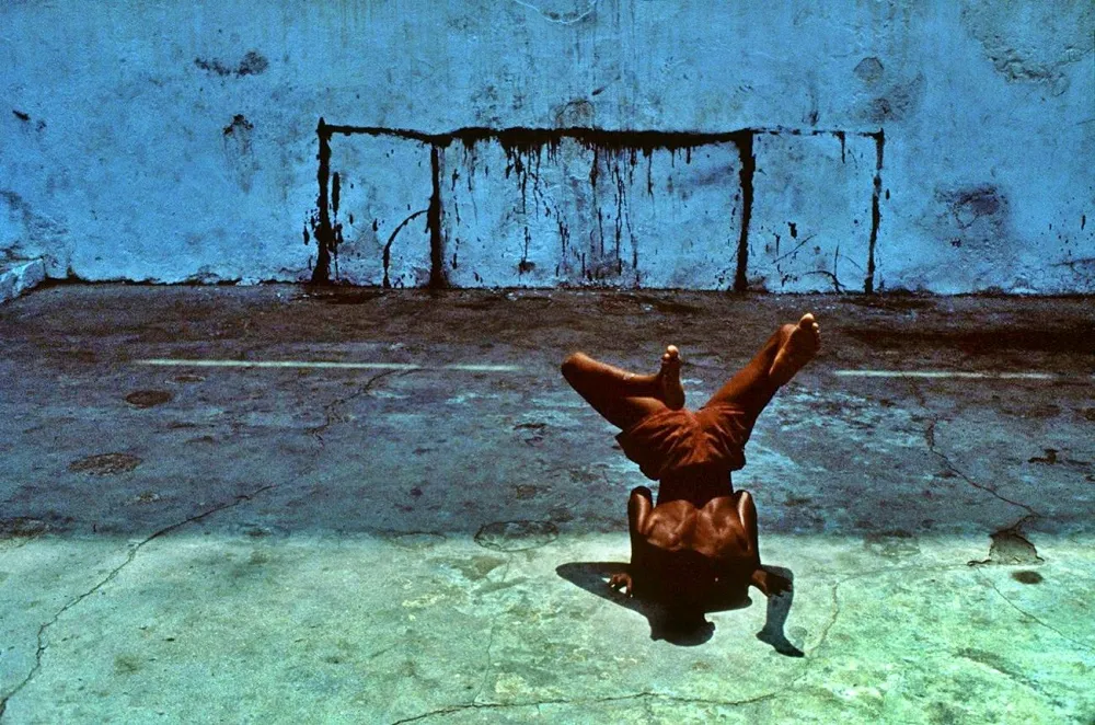 34.BAHIA Brazil—A boy dancing the capoeira a Brazilian art form 1985. Miguel Rio Branco