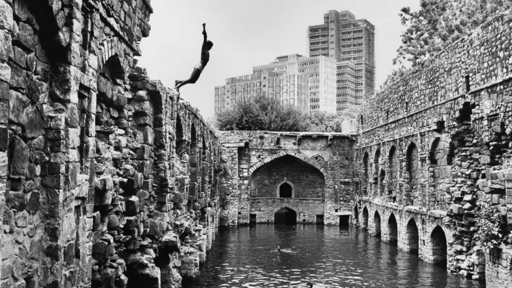16. Diving into Ugrasen Baoli Delhi. Raghu Rai