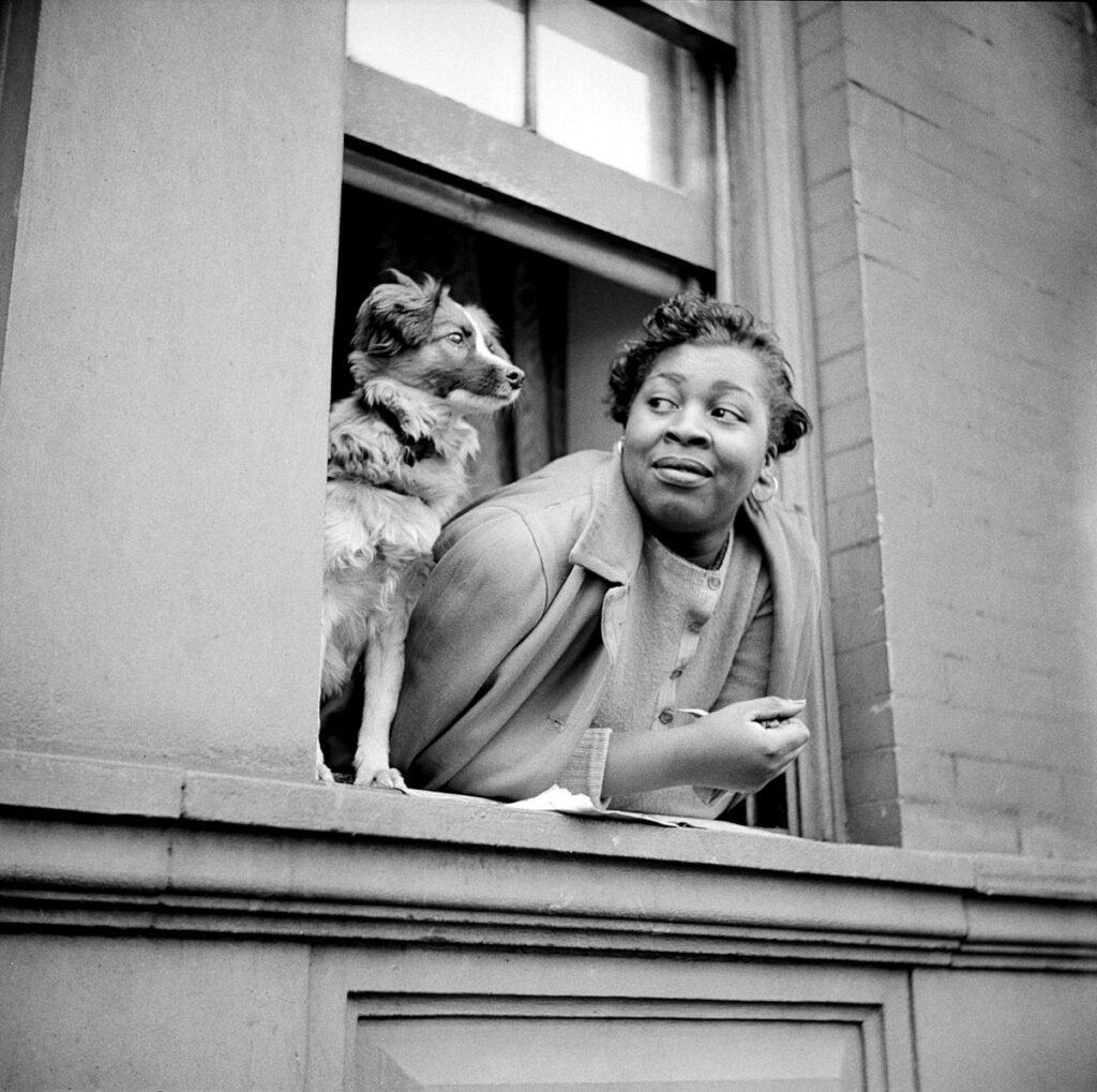 13.Woman and Dog in Window Harlem New York 1943.Gordon Parks photo