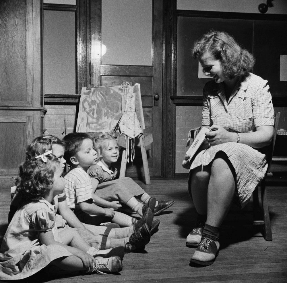 6.Teacher reading to young children at child care center New Britain Connecticut 1943